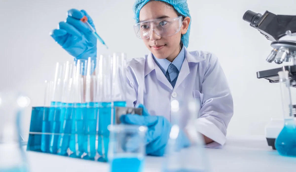 A lab technician checking the results of a saliva drug test